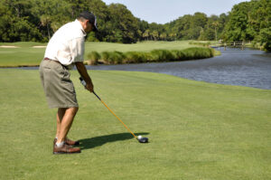 interventional spine pain pm&r job with man golfing on Hilton Head